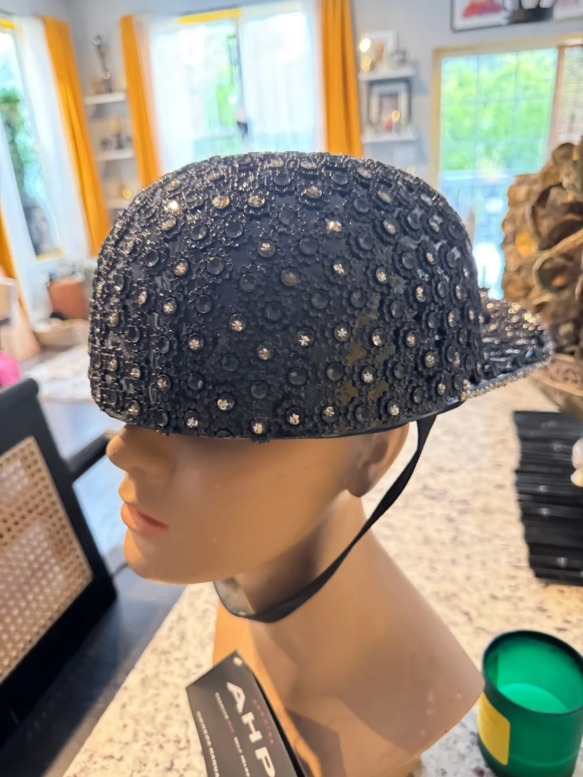 Side view of the Black Diamond Collection ball cap helmet on a mannequin