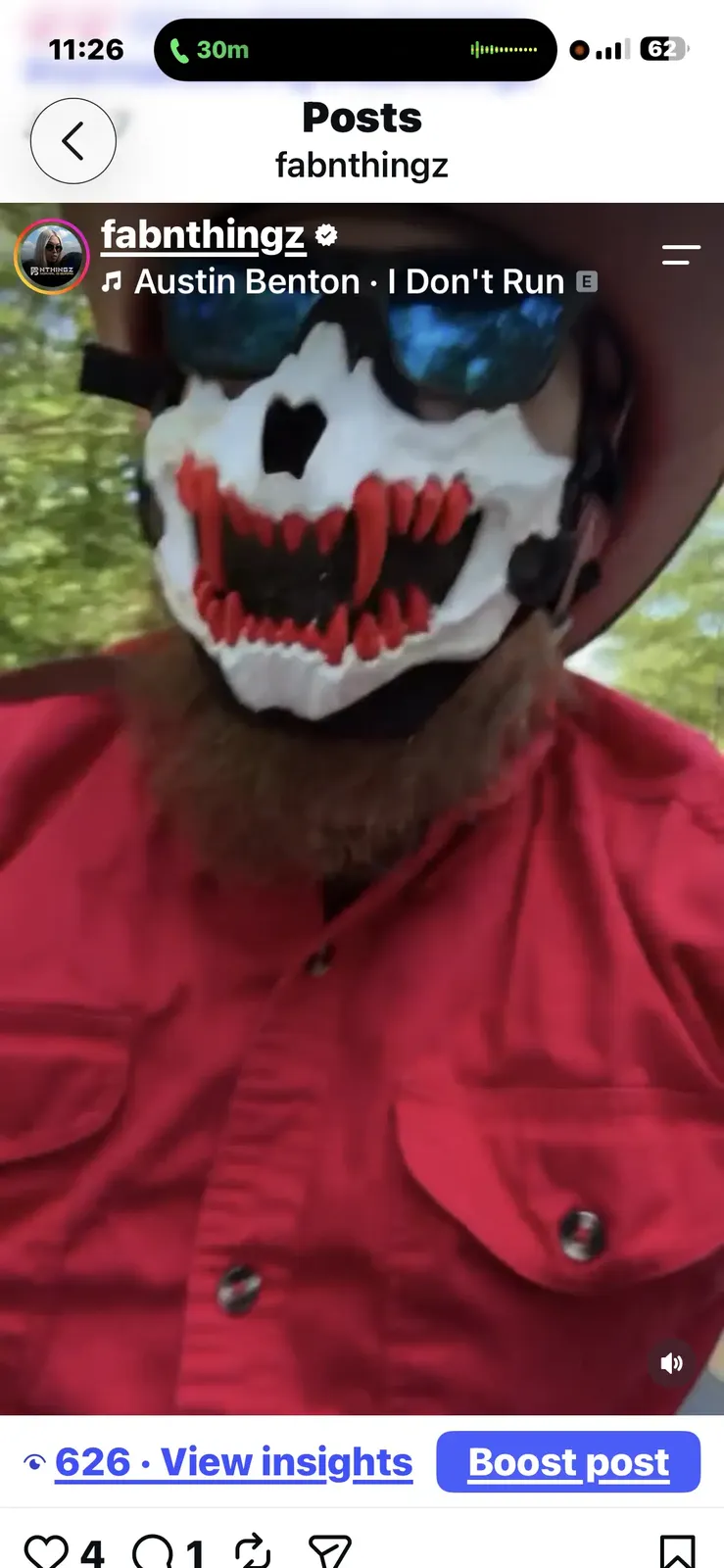 Rider wearing a graphic animal mask in a social media photo