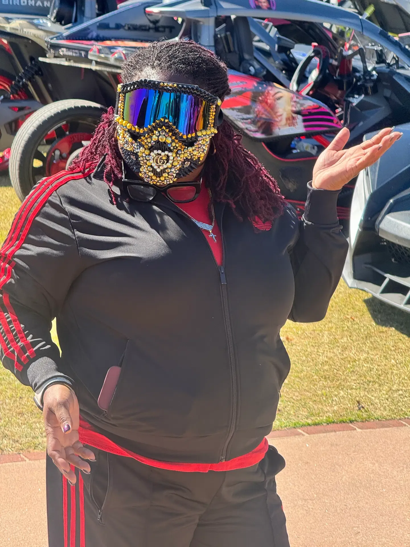 Attendee wearing a gold and black embellished mask at the festival